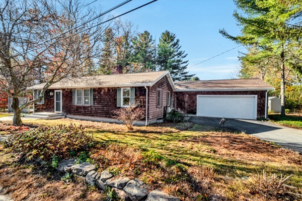 8 Rice Street Hopkinton, MA 01748 - Photo 1 of 16 a front view of a house with a yard