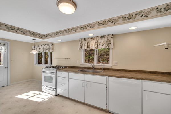 8 Rice Street Hopkinton, MA 01748 - Photo 5 of 16 a kitchen with a sink and cabinets
