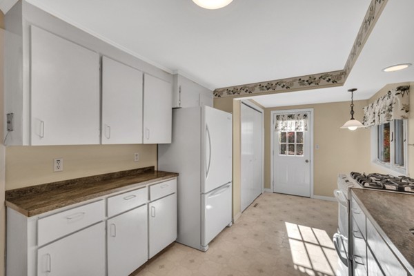 8 Rice Street Hopkinton, MA 01748 - Photo 6 of 16 a utility room with cabinets washer and dryer