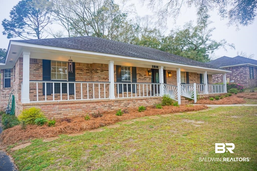 7225 Smithfield Road East Mobile, AL 36695 - Photo 2 of 27 Ranch-style house featuring a front yard, brick siding, and covered porch