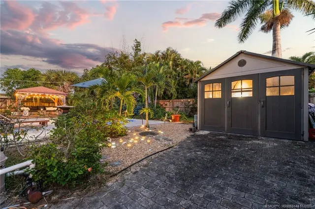 a kitchen with granite countertop a refrigerator and a sink