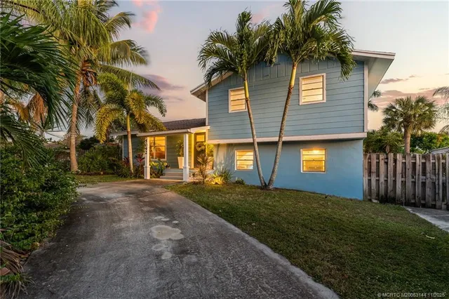 a lobby with furniture and a chandelier