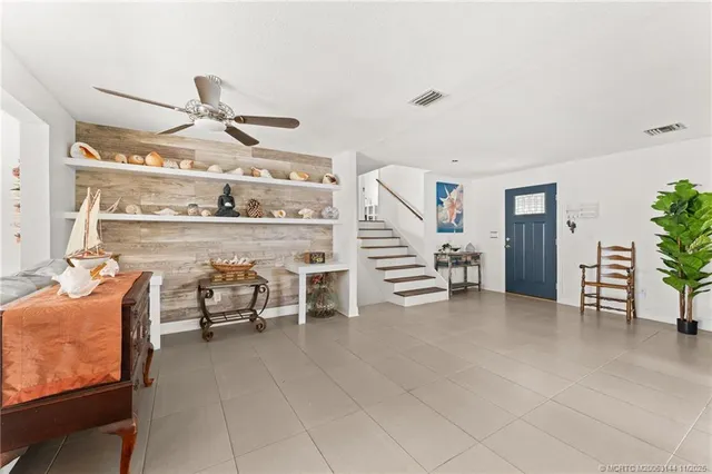 a bedroom with furniture and a book shelf