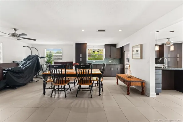 a view of a chair and table in the backyard