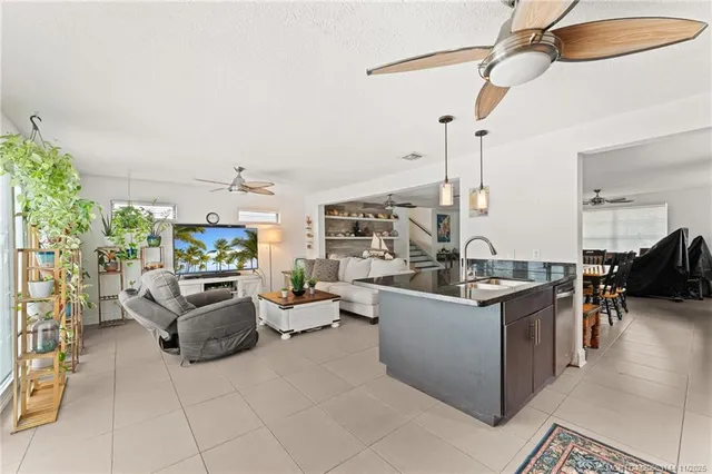 a view of a house with swimming pool and a yard