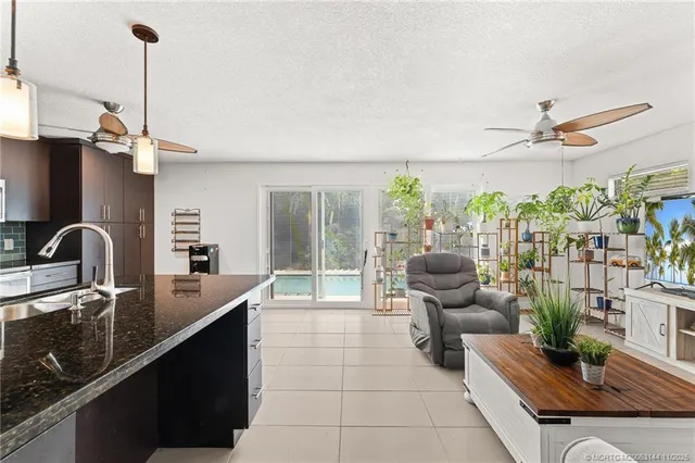 an aerial view of a house with a yard and swimming pool