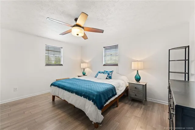 an aerial view of a house with a yard and swimming pool