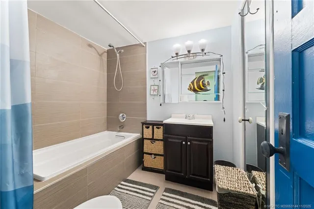 an aerial view of a house with a yard and outdoor seating