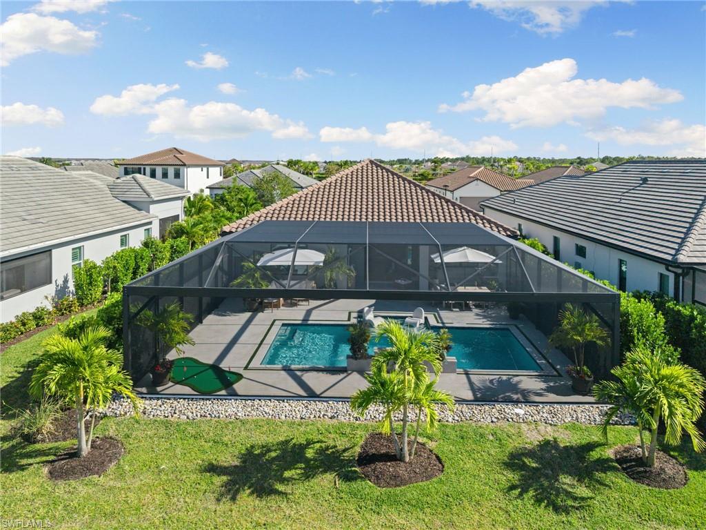 3967 Pegasus Way Naples, FL 34120 - Photo 37 of 50 a aerial view of a house with a yard