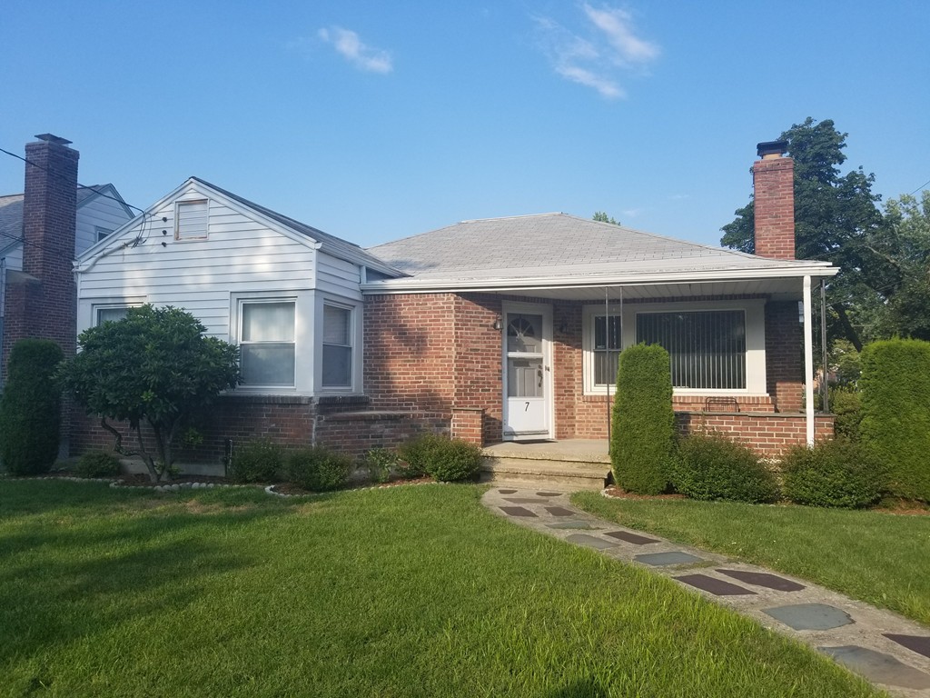 7 Lancaster Street Springfield, MA 01118 - Photo 1 of 25 a front view of a house with garden