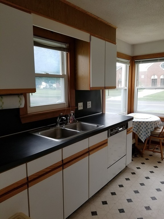 7 Lancaster Street Springfield, MA 01118 - Photo 11 of 25 a kitchen with a sink and a window