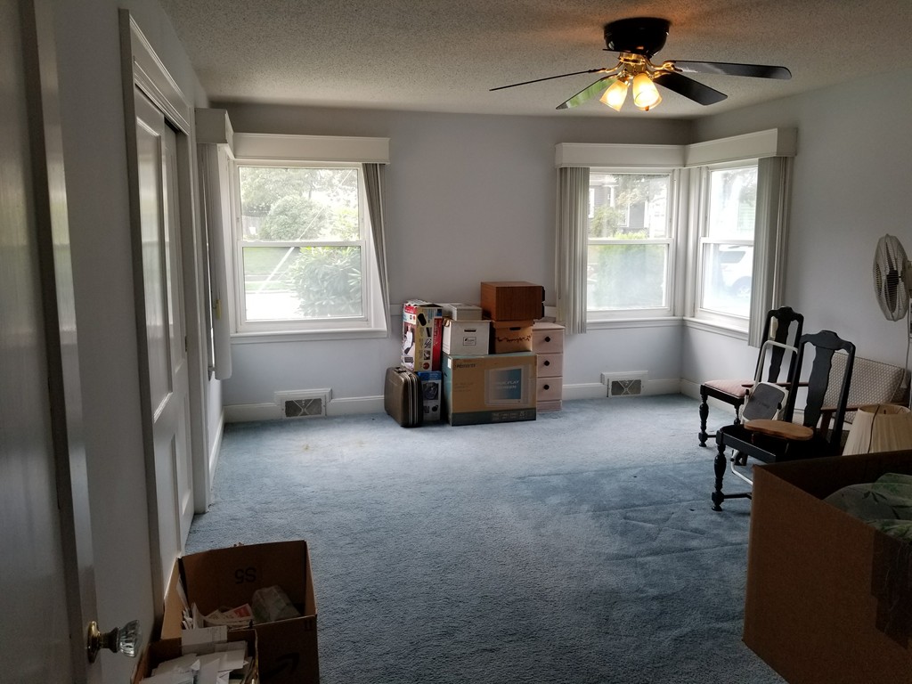 7 Lancaster Street Springfield, MA 01118 - Photo 20 of 25 a living room with furniture and a window