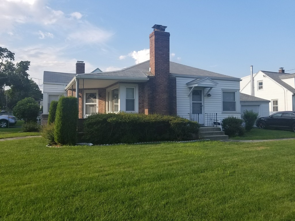 7 Lancaster Street Springfield, MA 01118 - Photo 3 of 25 a view of a house with a garden