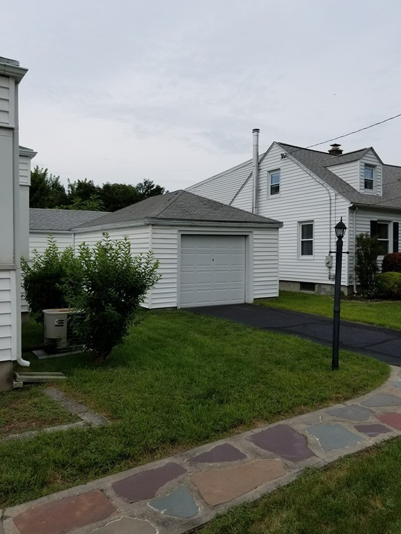 7 Lancaster Street Springfield, MA 01118 - Photo 6 of 25 a view of a house with a backyard