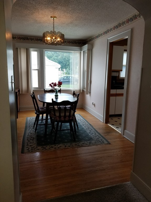 7 Lancaster Street Springfield, MA 01118 - Photo 7 of 25 a view of a dining room with furniture window and wooden floor