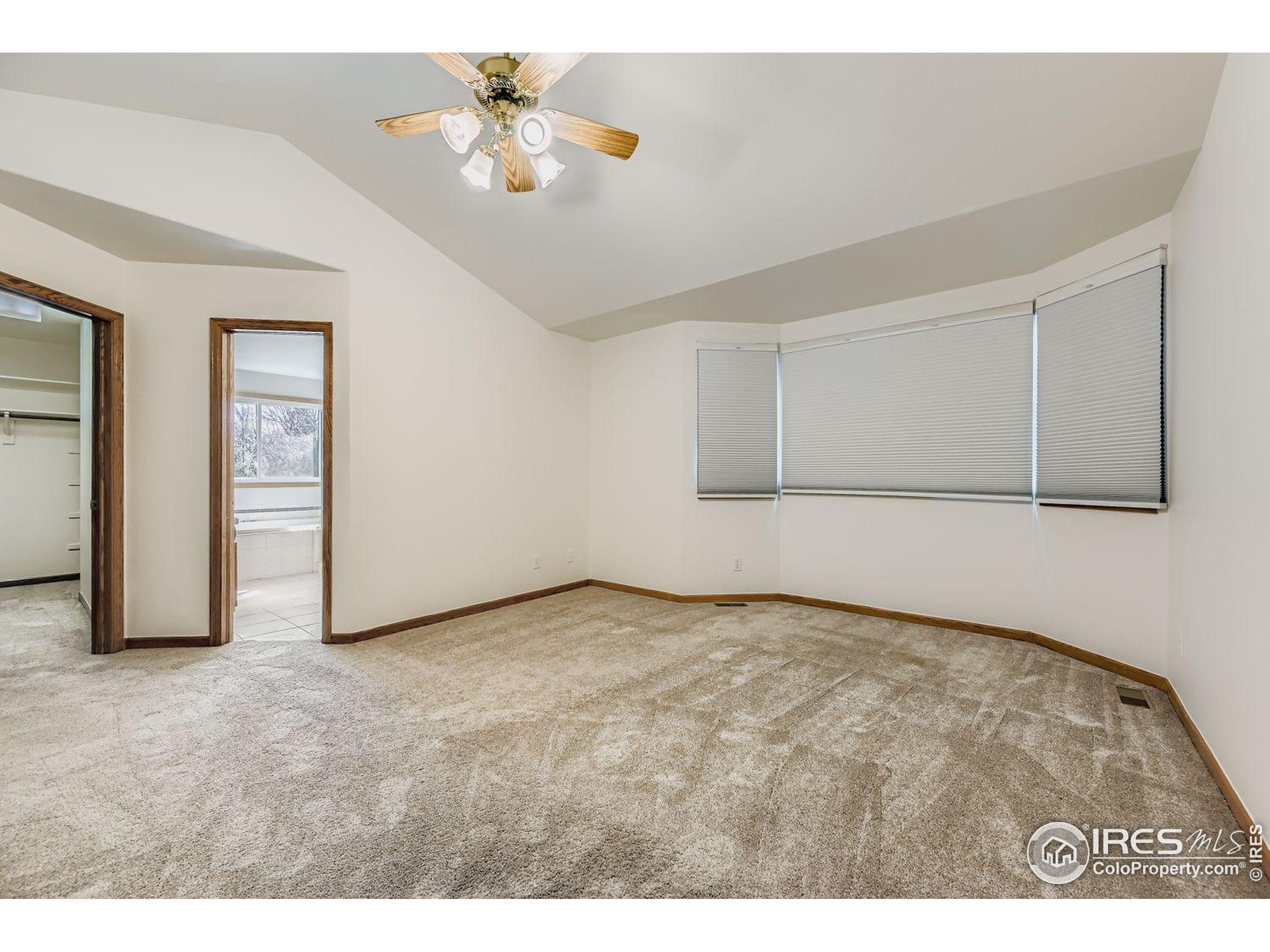 2062 Ridgeview Drive Longmont, CO 80504 - Photo 13 of 29 a view of an empty room with chandelier fan