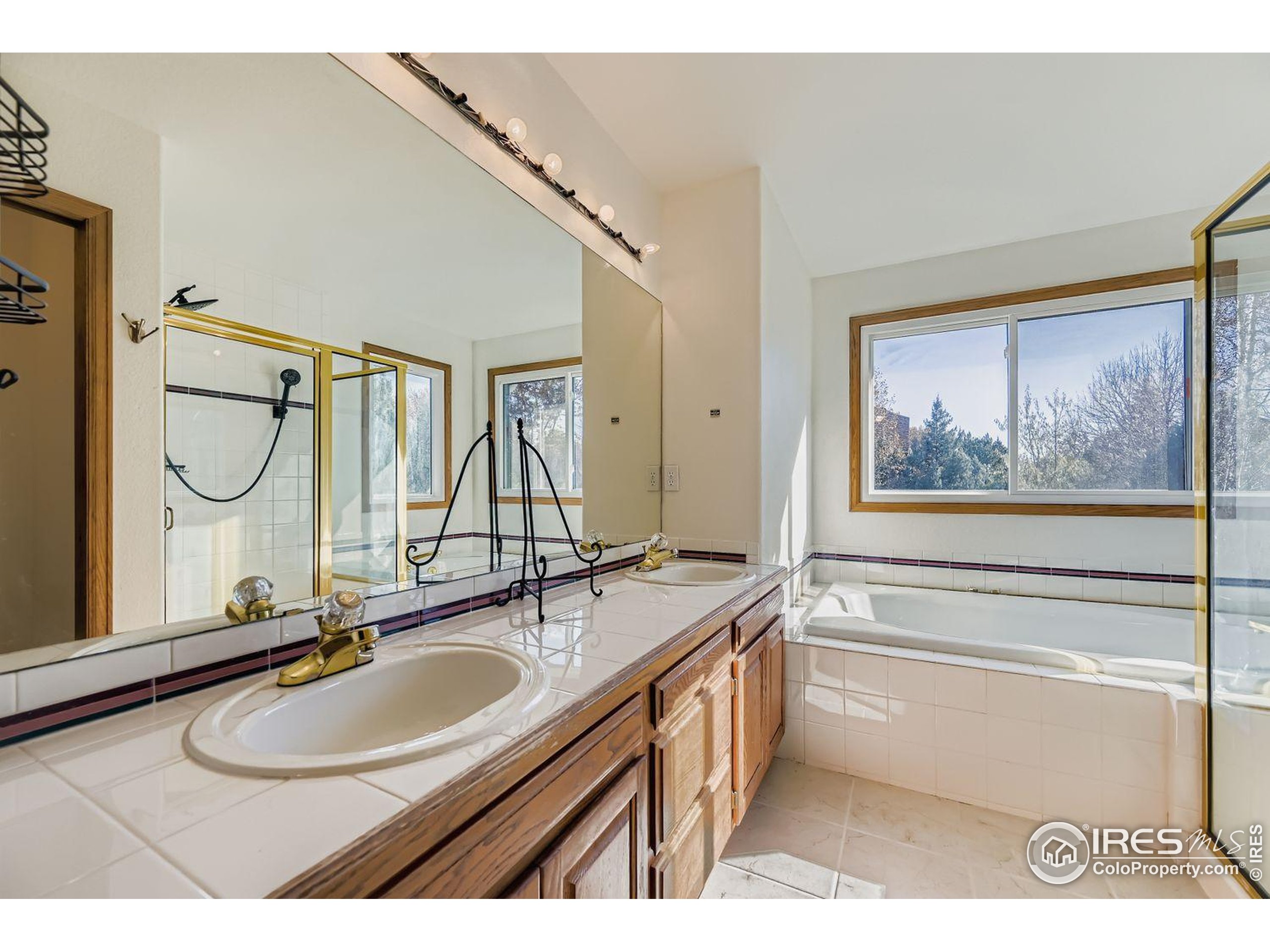 2062 Ridgeview Drive Longmont, CO 80504 - Photo 15 of 29 a bathroom with a sink and a mirror