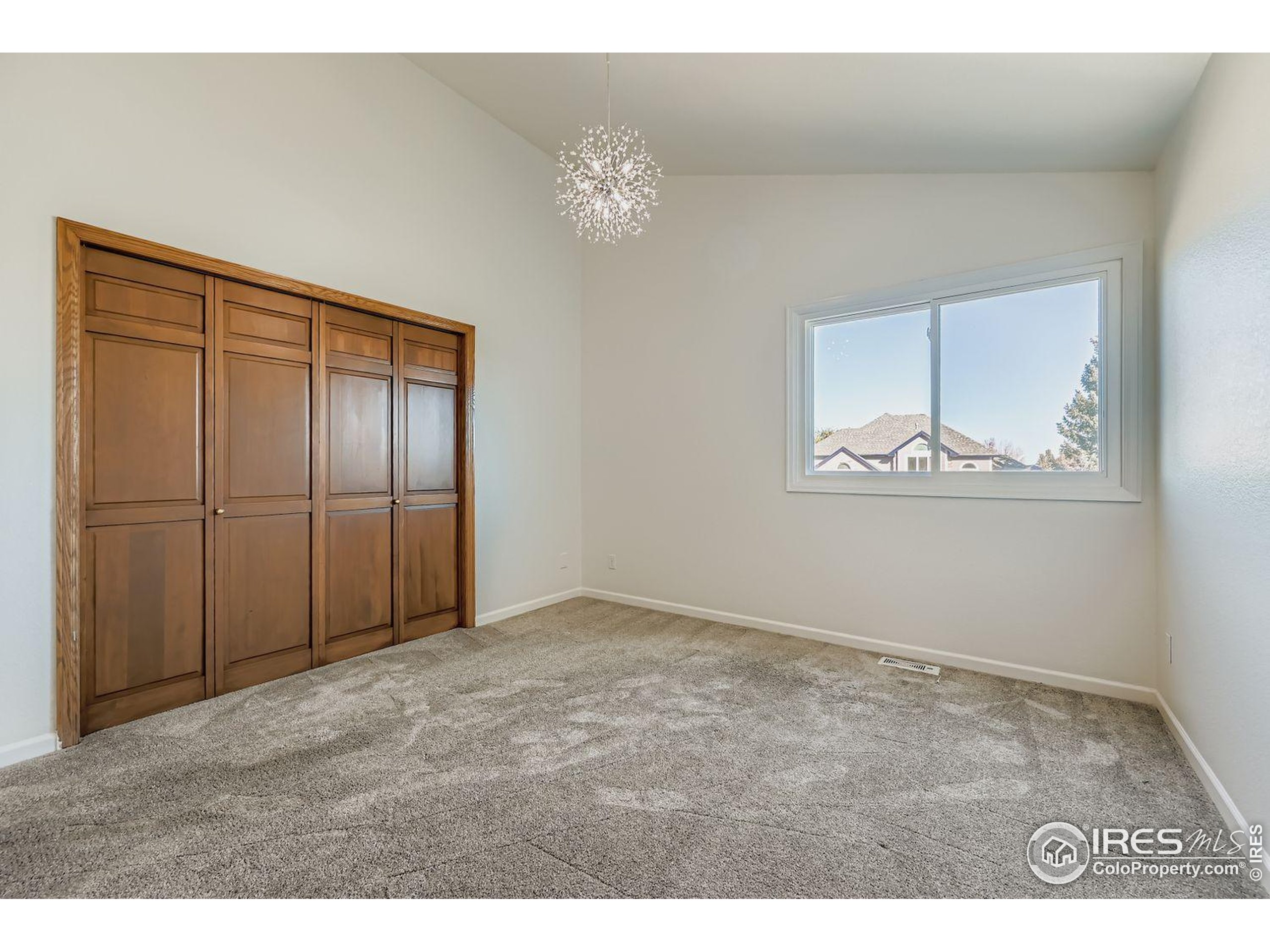 2062 Ridgeview Drive Longmont, CO 80504 - Photo 19 of 29 a view of an empty room with a window
