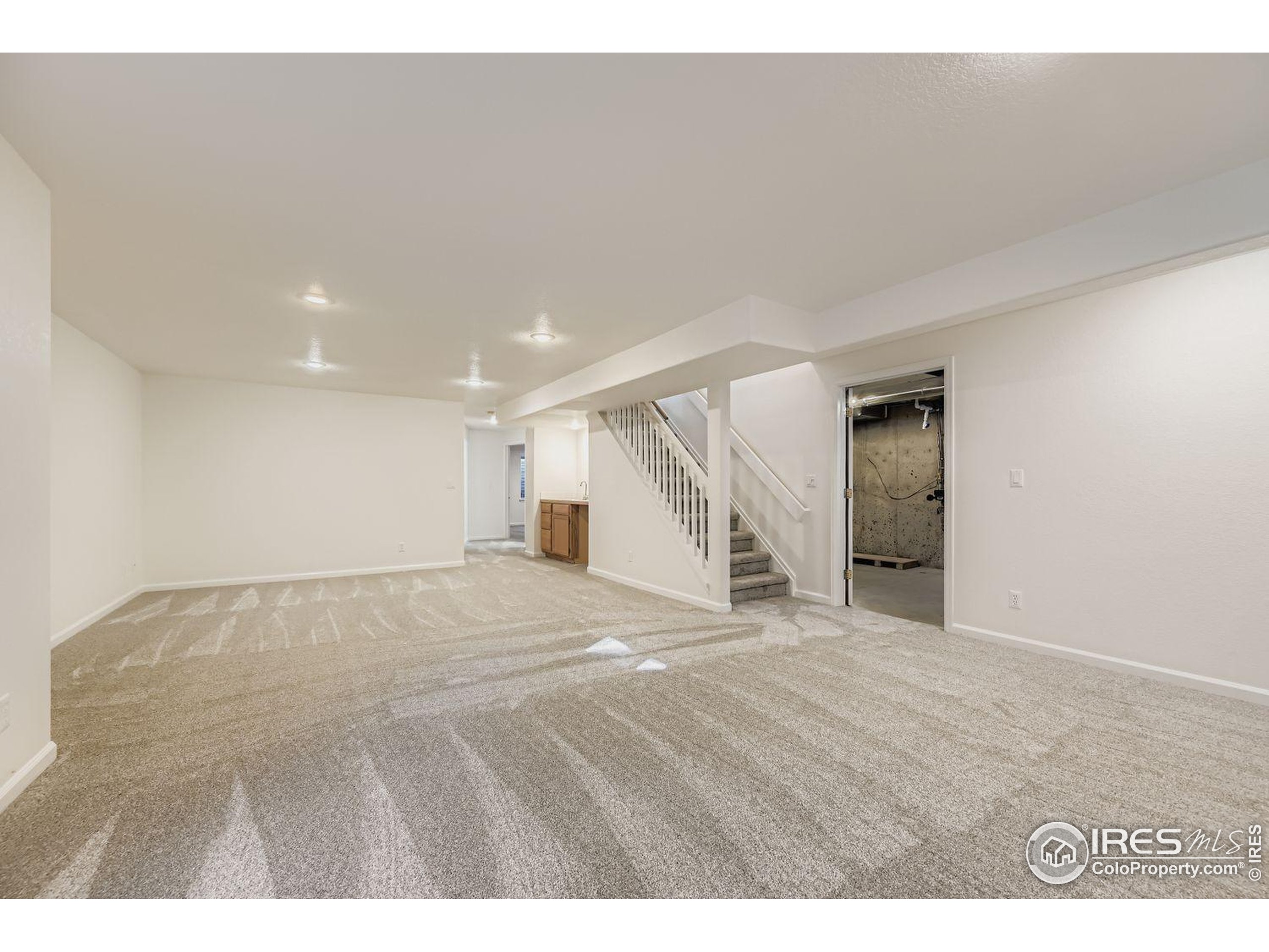 2062 Ridgeview Drive Longmont, CO 80504 - Photo 21 of 29 a view of an empty room with wooden floor