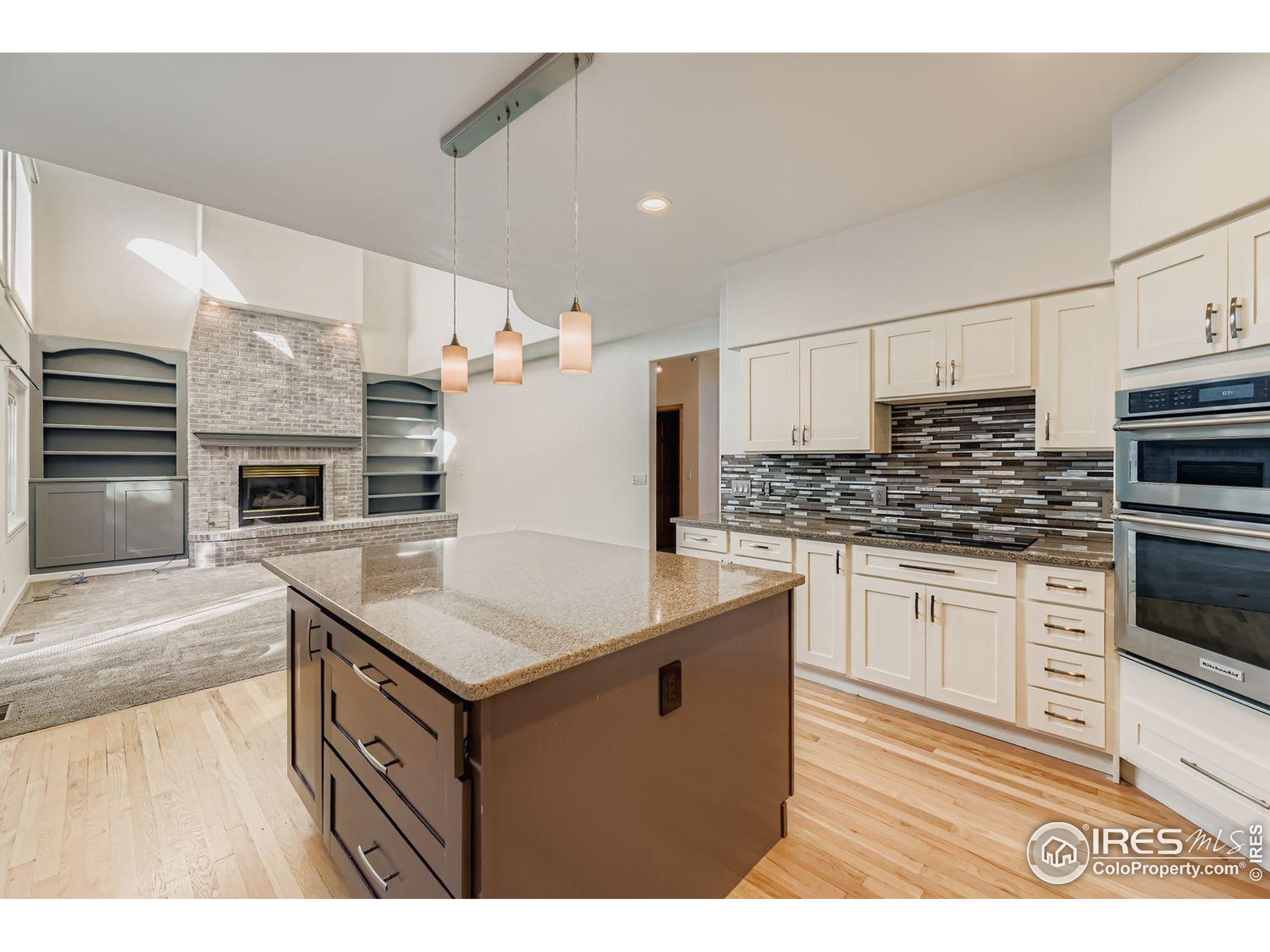 2062 Ridgeview Drive Longmont, CO 80504 - Photo 7 of 29 a kitchen with stainless steel appliances granite countertop a sink stove and refrigerator