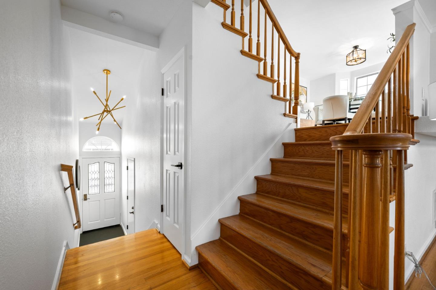 20659 Gardenside Circle Cupertino, CA 95014 - Photo 12 of 55 a view of entryway and hall with wooden floor