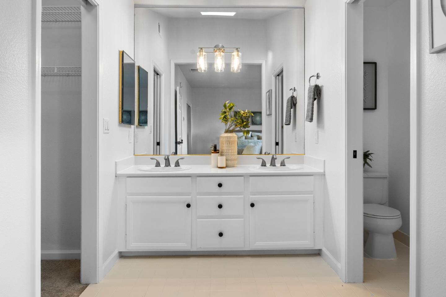 20659 Gardenside Circle Cupertino, CA 95014 - Photo 18 of 55 a bathroom with a double vanity sink mirror and toilet
