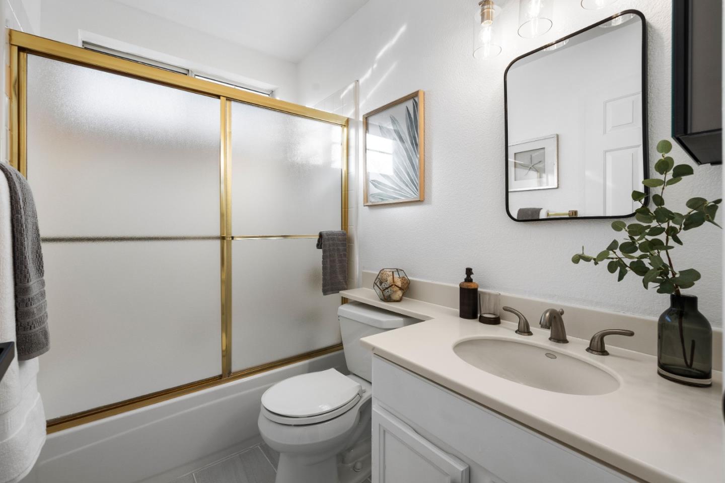 20659 Gardenside Circle Cupertino, CA 95014 - Photo 23 of 55 a bathroom with a sink toilet and mirror