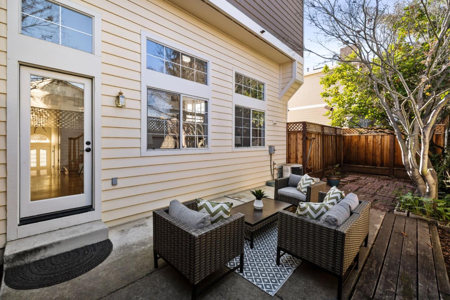 20659 Gardenside Circle Cupertino, CA 95014 - Photo 24 of 55 a view of a chairs and table in the back yard of the house