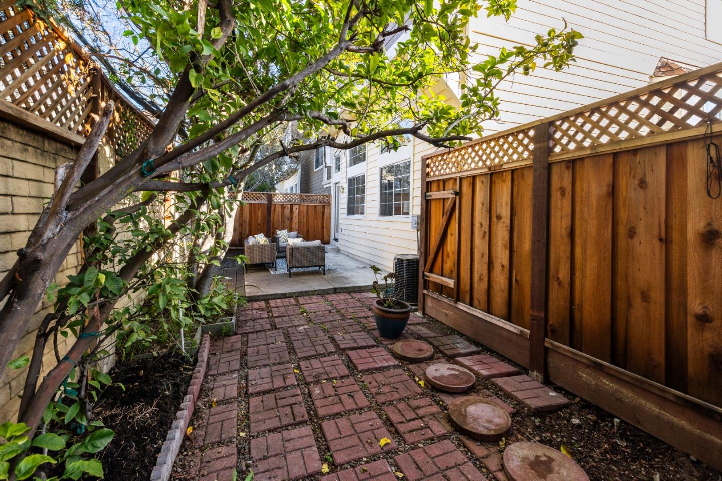 20659 Gardenside Circle Cupertino, CA 95014 - Photo 26 of 55 a view of a backyard with wooden fence