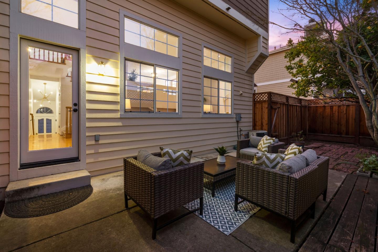 20659 Gardenside Circle Cupertino, CA 95014 - Photo 33 of 55 a view of a patio with couches and a fire pit and wooden fence