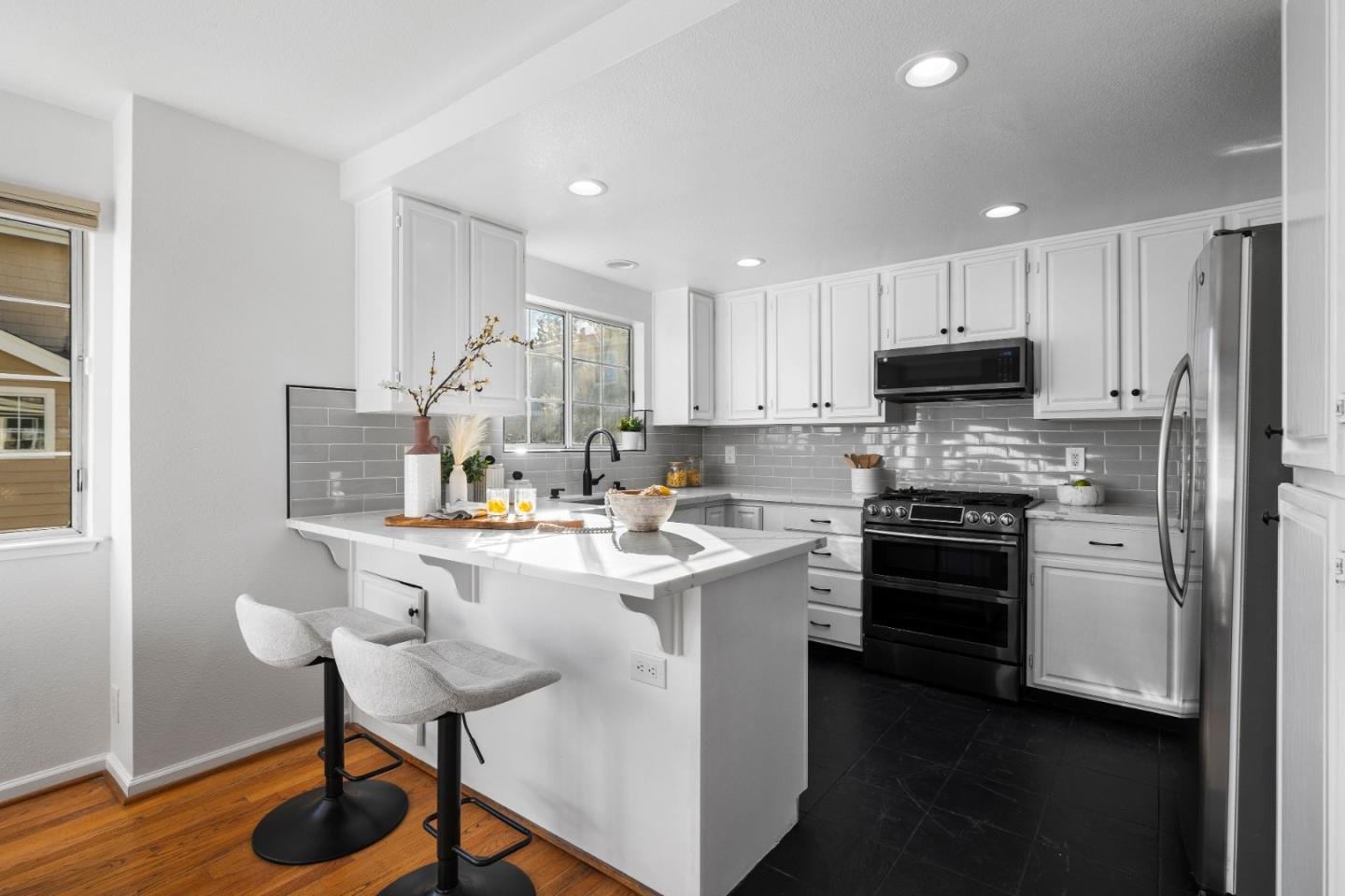 20659 Gardenside Circle Cupertino, CA 95014 - Photo 4 of 55 a kitchen with a sink a stove a refrigerator cabinets and a dining table