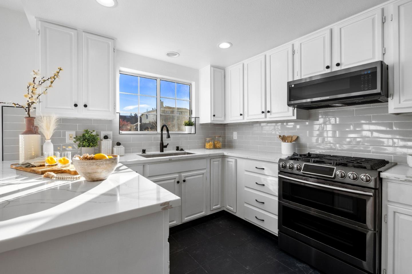 20659 Gardenside Circle Cupertino, CA 95014 - Photo 5 of 55 a kitchen with stainless steel appliances a stove a sink and a microwave