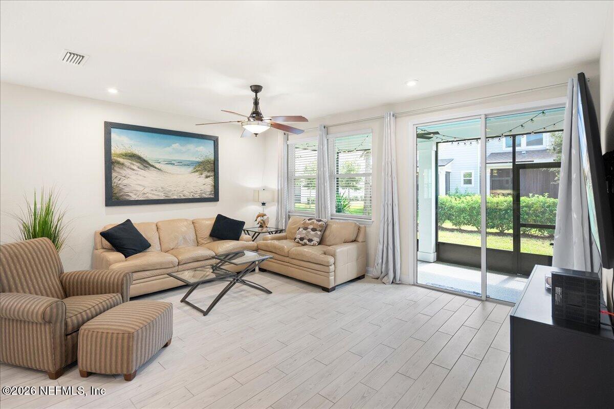 14158 Backbarrier Road Jacksonville, FL 32224 - Photo 6 of 31 Tile plank flooring on first floor