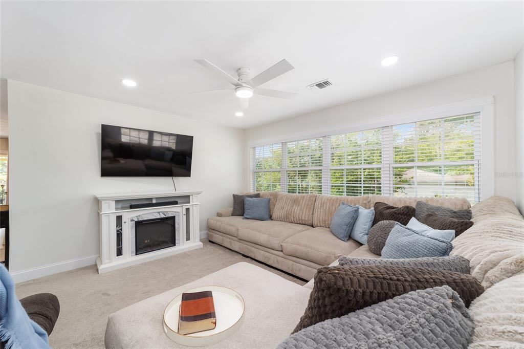 9040 Southwest 209th Circle Dunnellon, FL 34431 - Photo 13 of 55 a living room with furniture and a flat screen tv