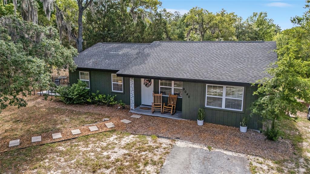 9040 Southwest 209th Circle Dunnellon, FL 34431 - Photo 2 of 55 a front view of a house with garden