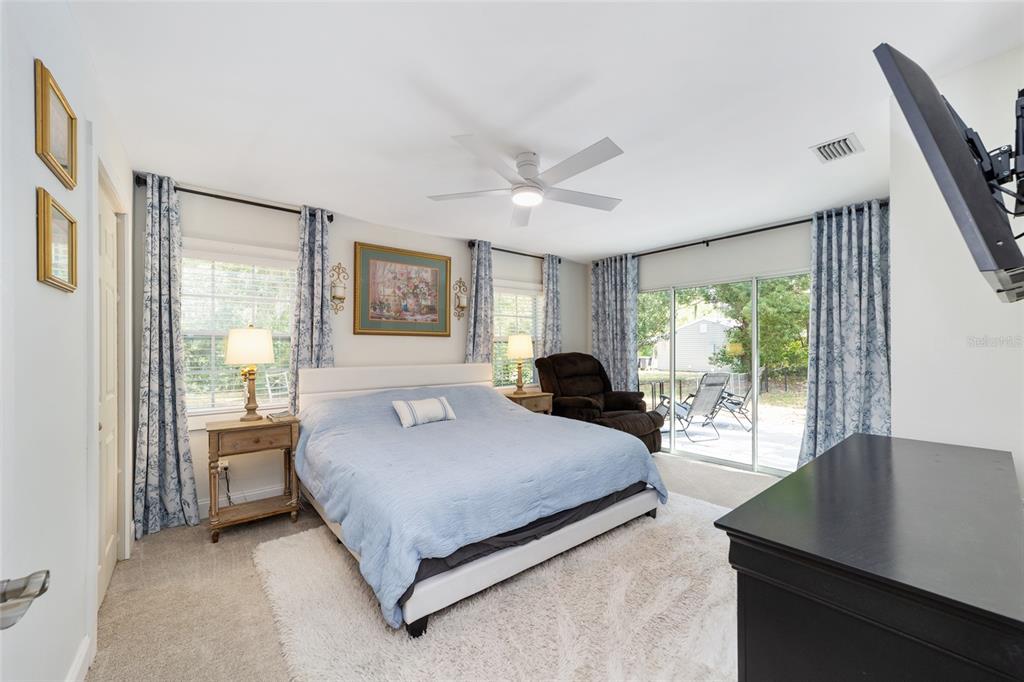 9040 Southwest 209th Circle Dunnellon, FL 34431 - Photo 24 of 55 a bedroom with a large bed and a window