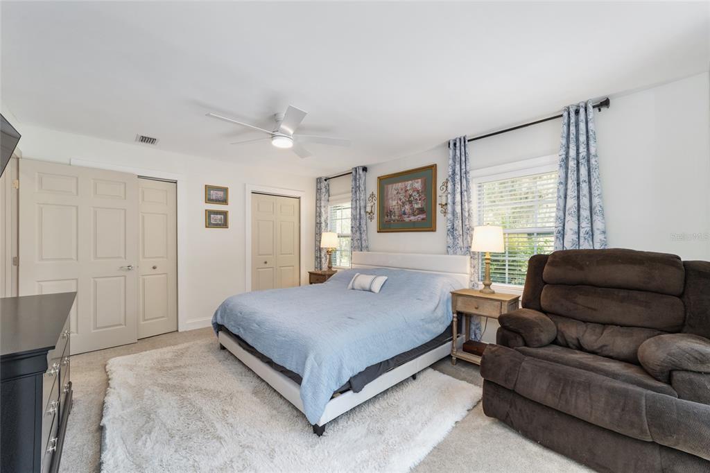 9040 Southwest 209th Circle Dunnellon, FL 34431 - Photo 25 of 55 a bedroom with a bed couch and window