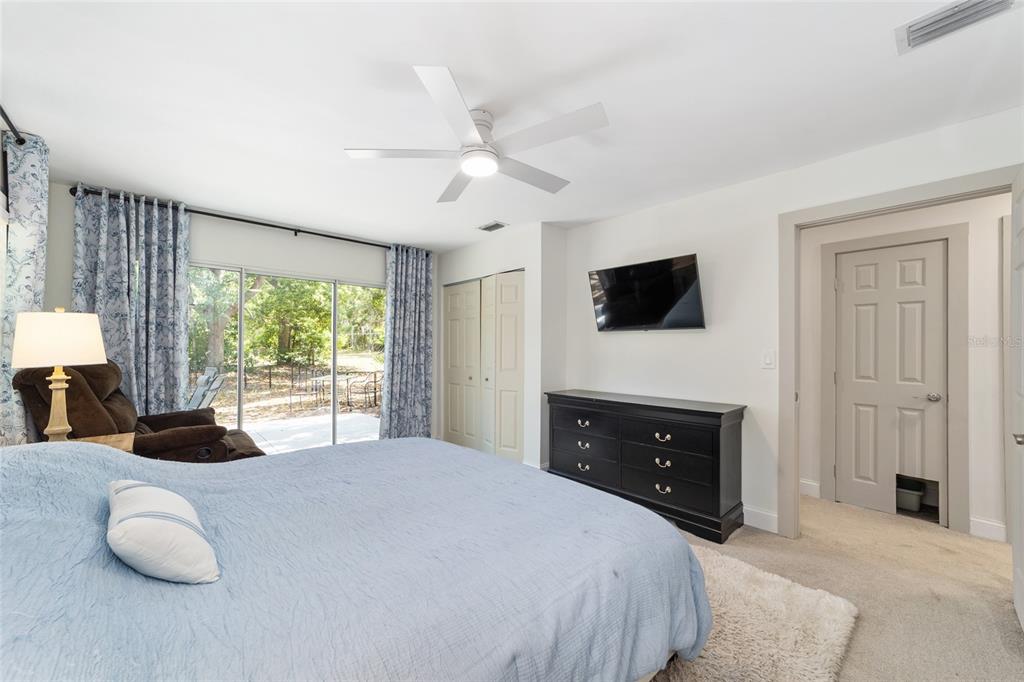 9040 Southwest 209th Circle Dunnellon, FL 34431 - Photo 26 of 55 a bedroom with a bed and a flat screen tv