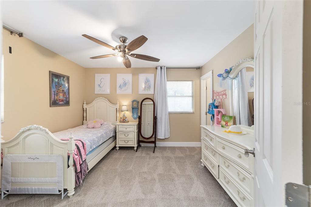 9040 Southwest 209th Circle Dunnellon, FL 34431 - Photo 28 of 55 a bedroom with furniture and a chandelier