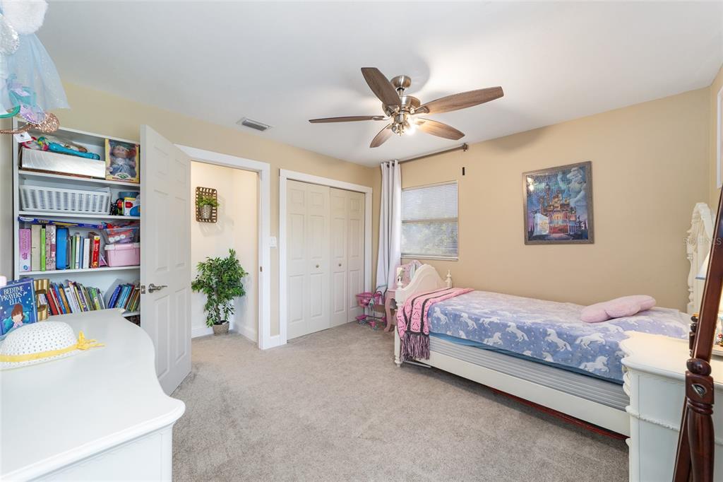 9040 Southwest 209th Circle Dunnellon, FL 34431 - Photo 29 of 55 a bedroom with a bed furniture and a chandelier