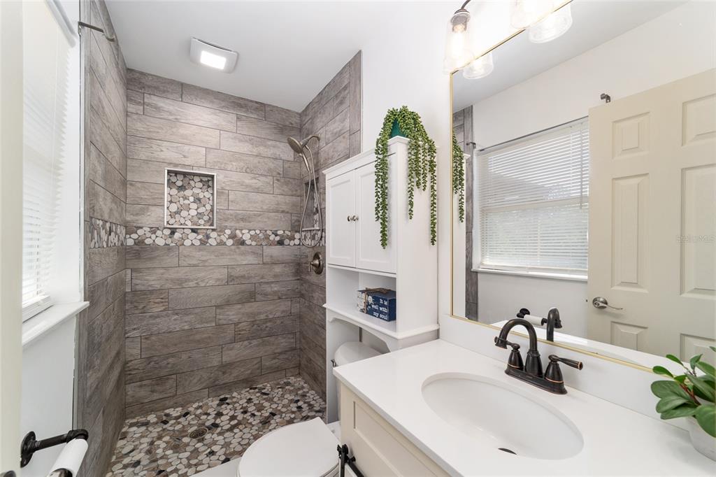 9040 Southwest 209th Circle Dunnellon, FL 34431 - Photo 30 of 55 a bathroom with a sink shower and a mirror