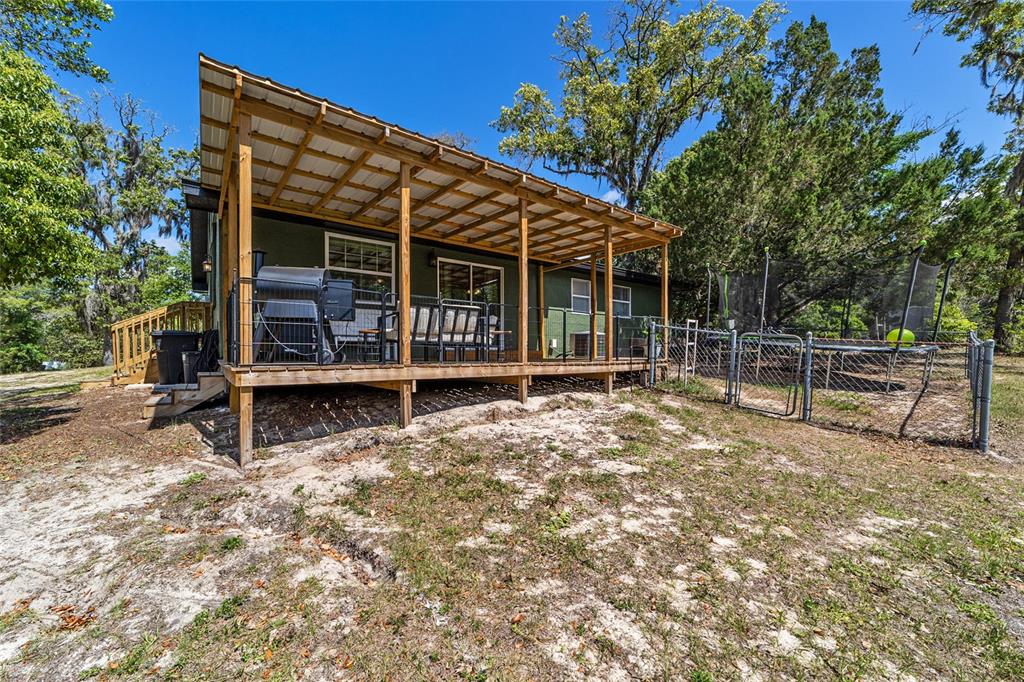 9040 Southwest 209th Circle Dunnellon, FL 34431 - Photo 36 of 55 a view of a house with backyard and a tree