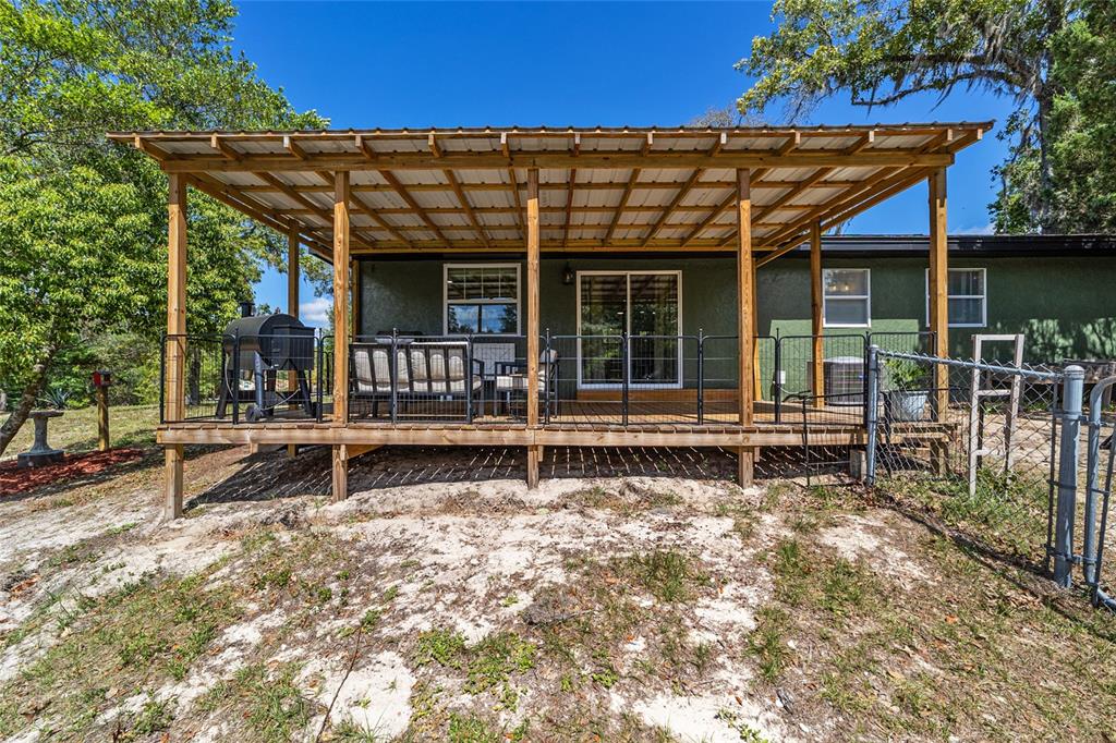 9040 Southwest 209th Circle Dunnellon, FL 34431 - Photo 37 of 55 front view of a house with a porch