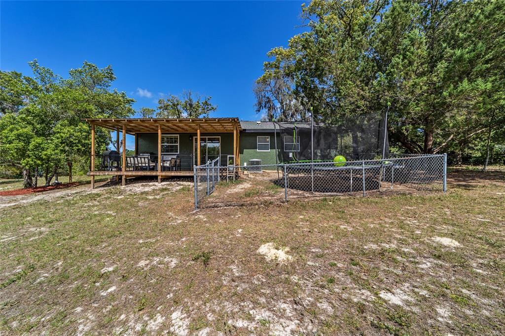 9040 Southwest 209th Circle Dunnellon, FL 34431 - Photo 38 of 55 front view of a house with a yard