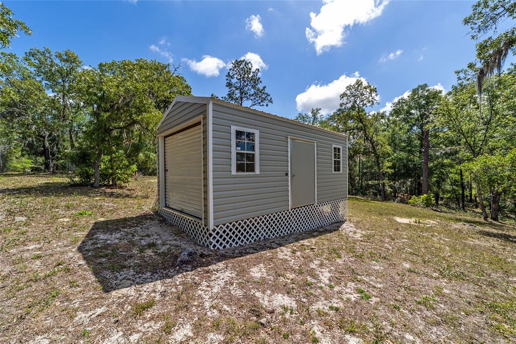 9040 Southwest 209th Circle Dunnellon, FL 34431 - Photo 40 of 55 a view of a house with a yard