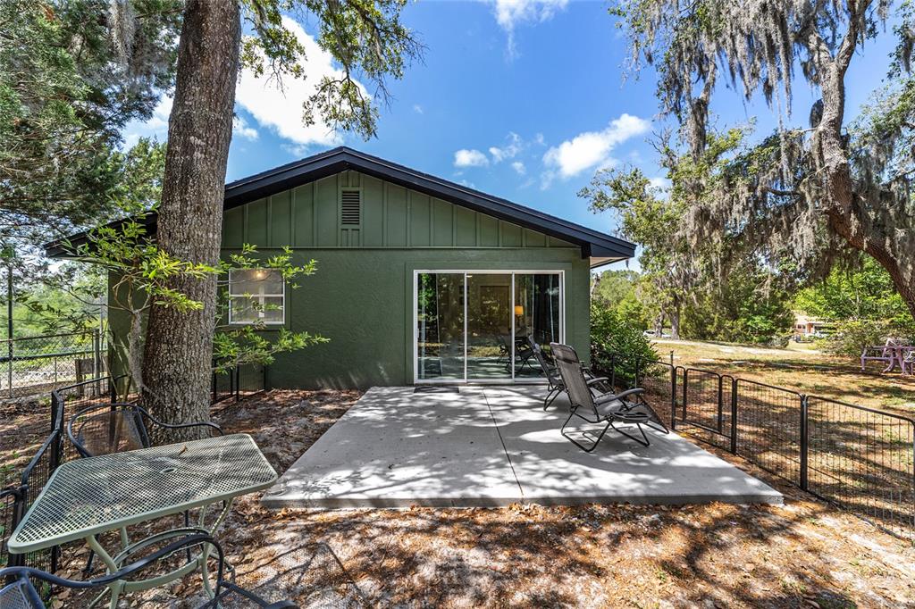 9040 Southwest 209th Circle Dunnellon, FL 34431 - Photo 42 of 55 a front view of a house with garden