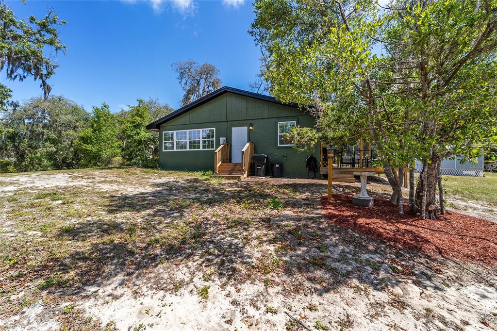 9040 Southwest 209th Circle Dunnellon, FL 34431 - Photo 44 of 55 a view of a house with a yard