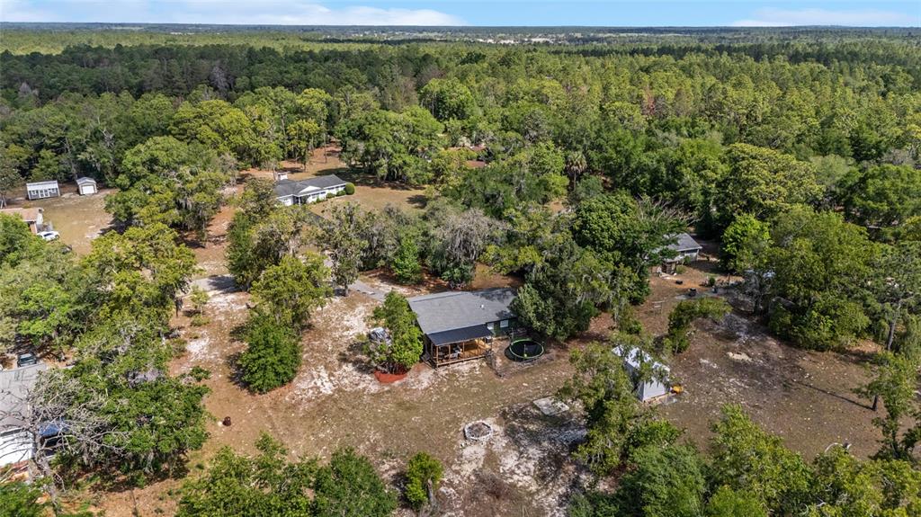 9040 Southwest 209th Circle Dunnellon, FL 34431 - Photo 53 of 55 an aerial view of a house with a yard