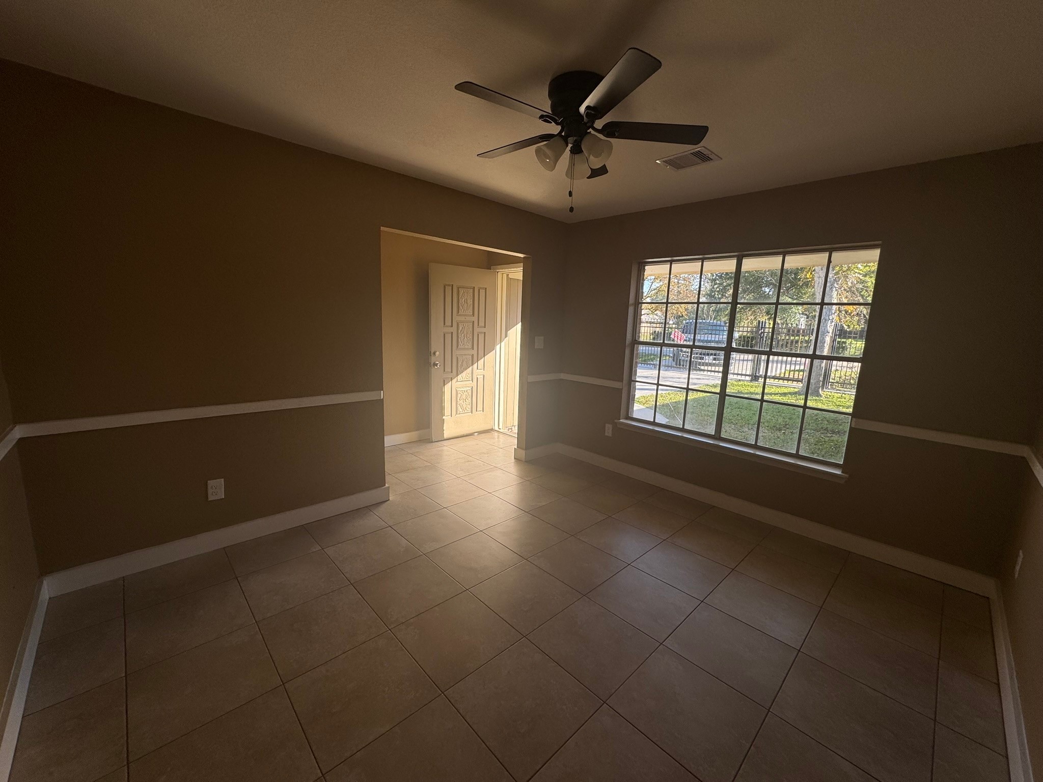 207 East Mitchell Road Houston, TX 77037 - Photo 5 of 6 a view of an empty room with a window