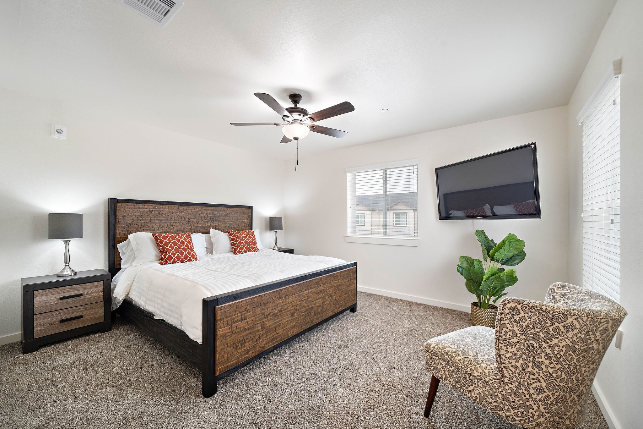 12603 Telge Road, Unit 17B Cypress, TX 77429 - Photo 13 of 21 a bedroom with a bed potted plant on a bed and a window